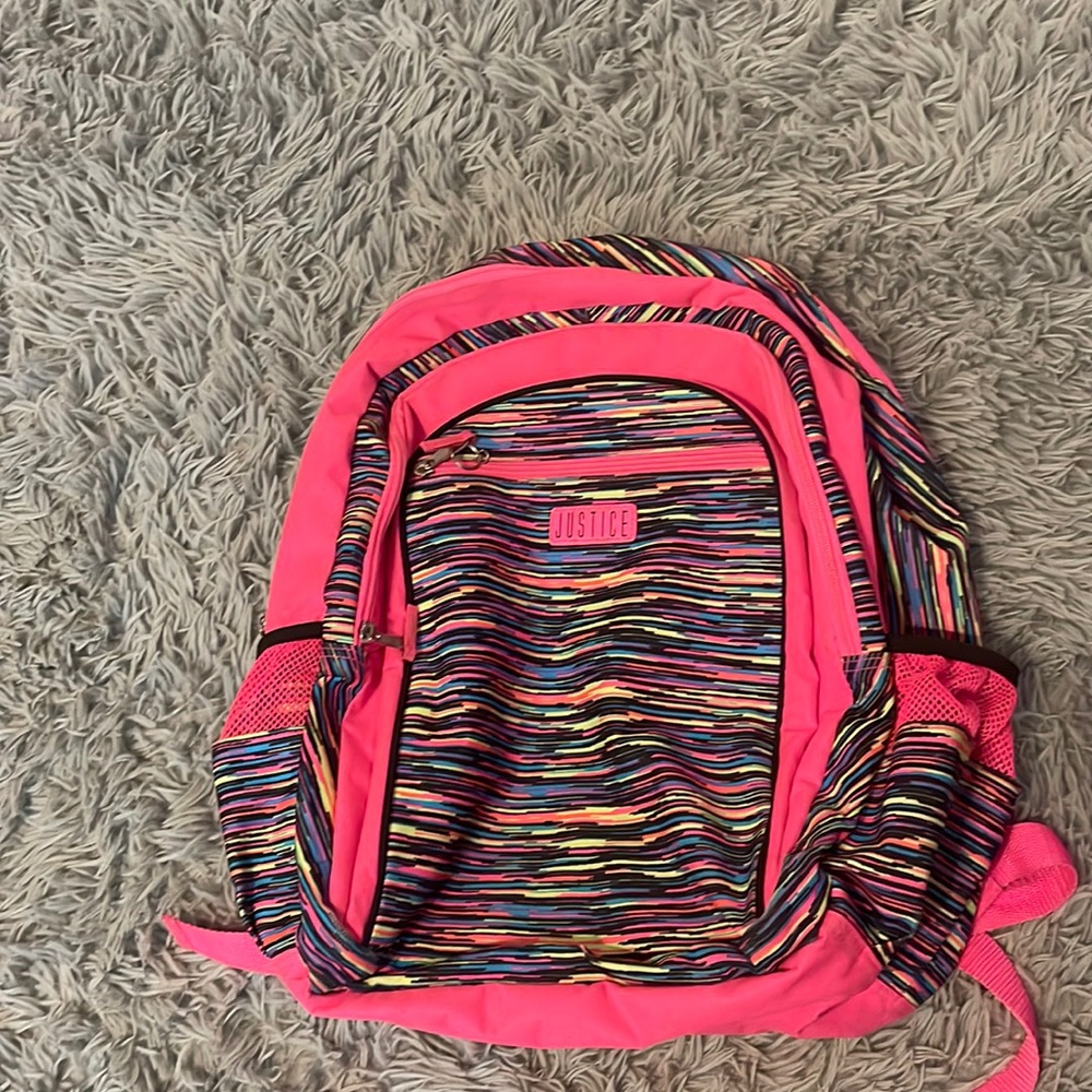 Pink and rainbow backpack with lots of pockets perfect for back to school